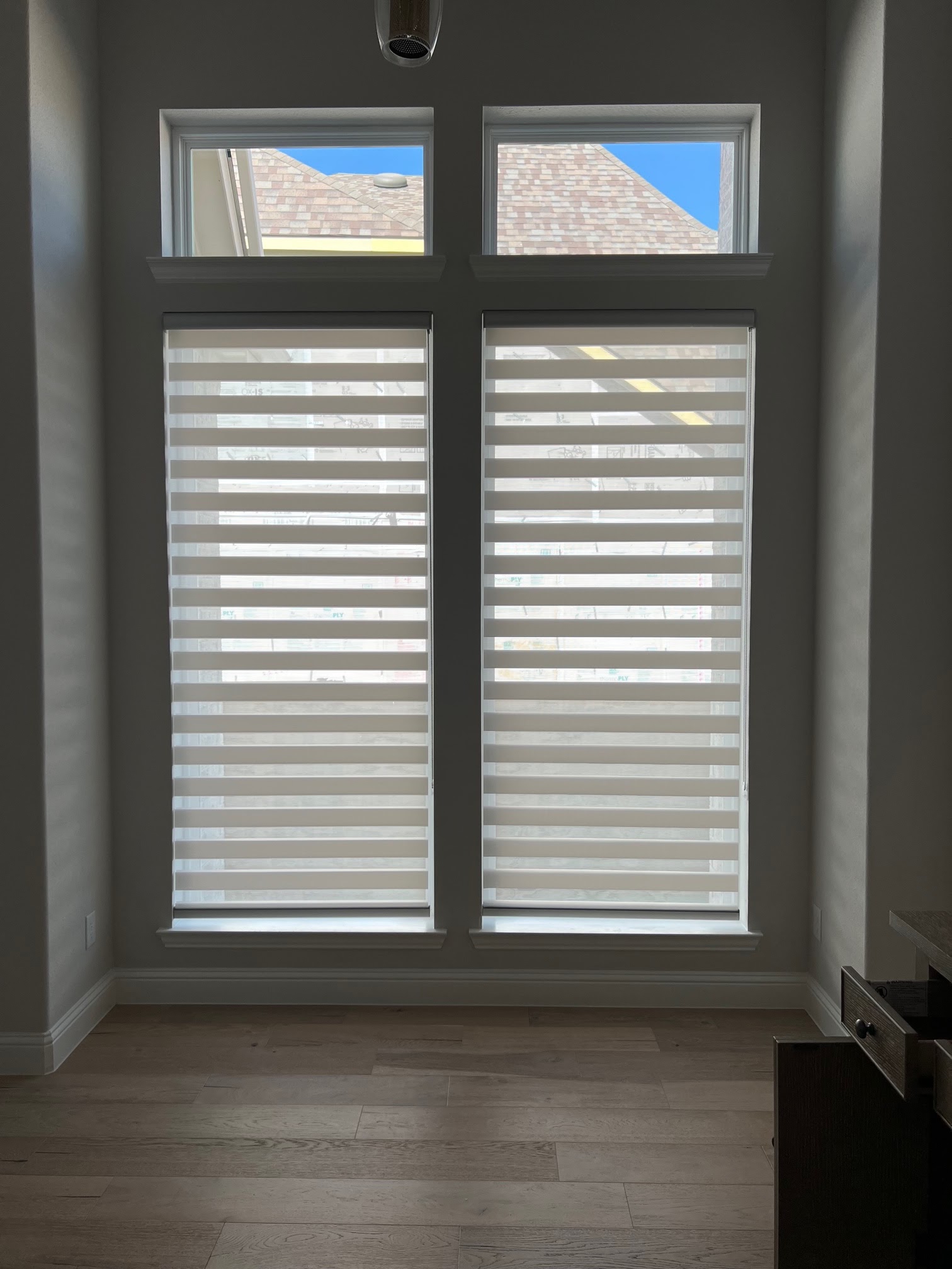 Zebra roller shades installed in a bright modern home